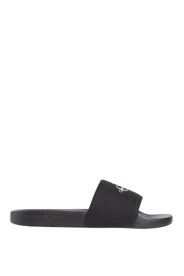 Calvin Klein Slide-Sandalen mit eingraviertem Logo. Schwarz