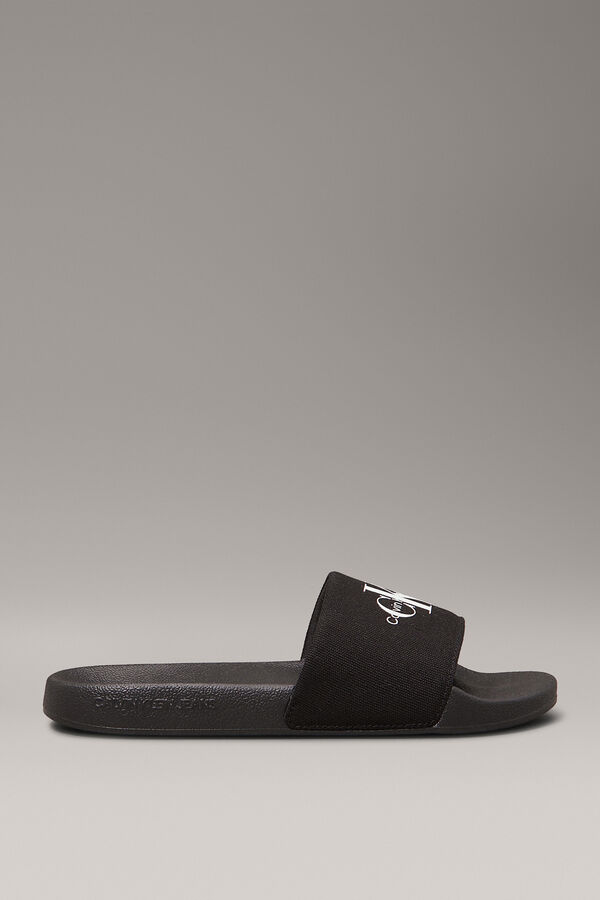 Calvin Klein Slide-Sandalen mit eingraviertem Logo. Schwarz