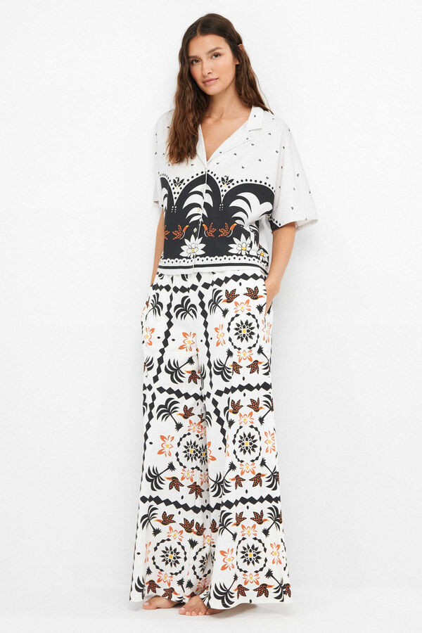 Gisela Tropical print long trousers white