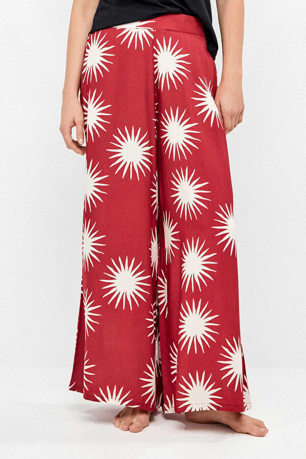 Gisela Pantal&oacute;n largo pierna ancha estampado soles blanco