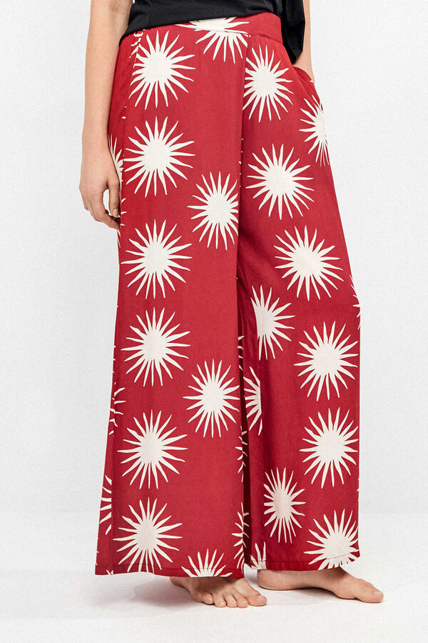 Gisela Pantal&oacute;n largo pierna ancha estampado soles blanco